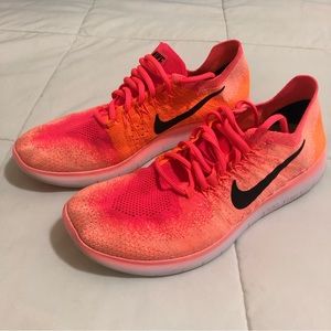 Women’s Nike Free RN Flyknit, size 10, bright pink and orange color.
